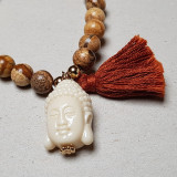 Bracelet pompon beige et Bouddha