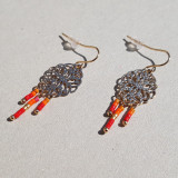 Boucles d'oreilles métal doré et perles orange