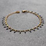 Bracelet petites pattes dorées et noires