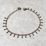 Bracelet petites pattes dorées et noires