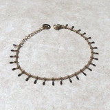 Bracelet petites pattes dorées et noires