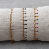 Bracelet petites pattes dorées et noires