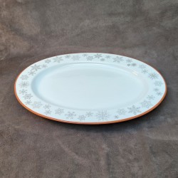 Plat ovale en porcelaine décoré de flocons