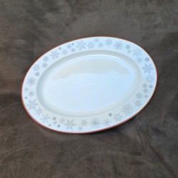 Plat ovale en porcelaine décoré de flocons